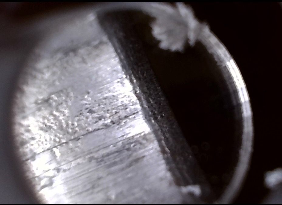 Borescope view of the Stevens 44 bore near a groove edge with fouling