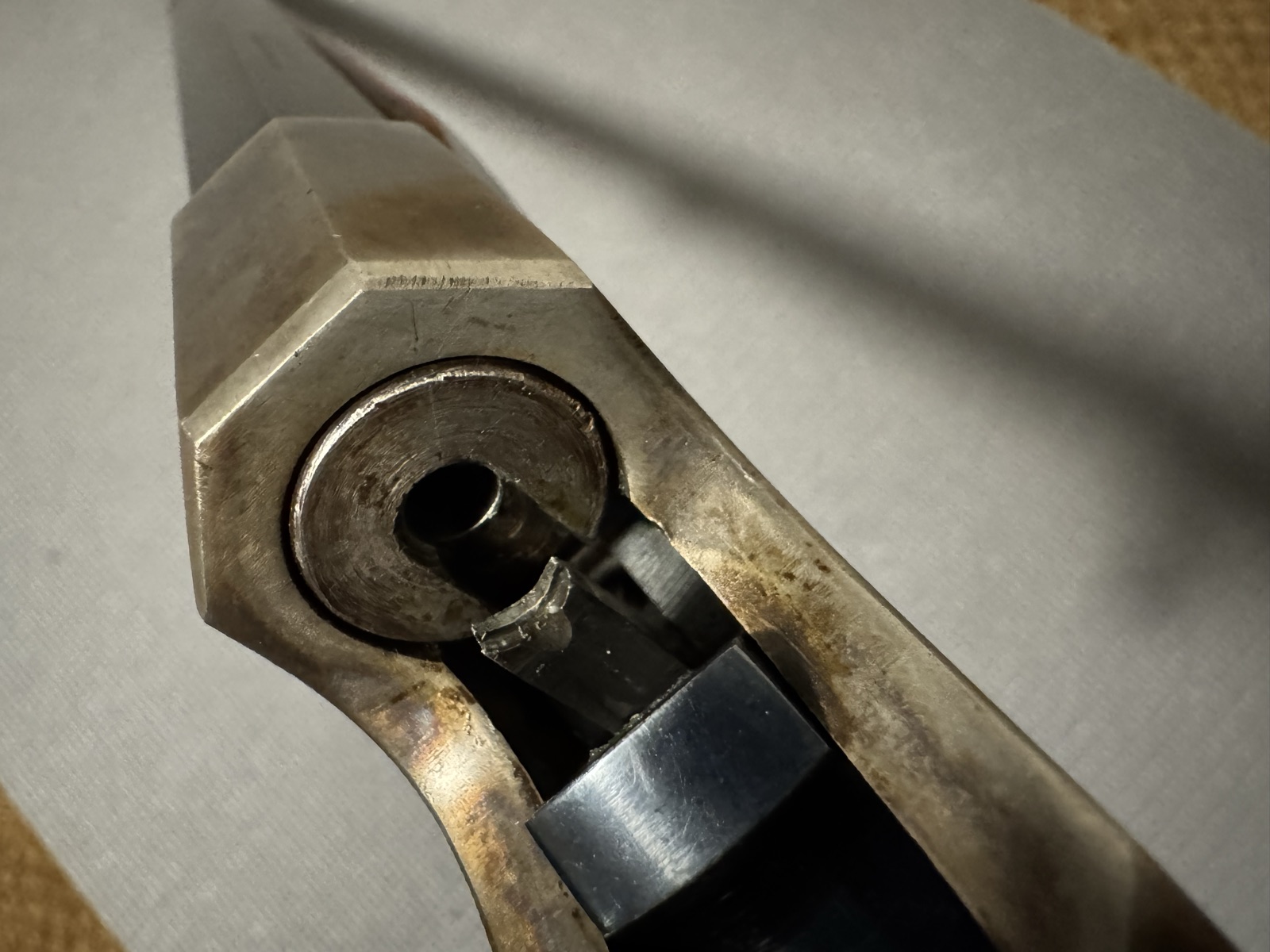 Close view of the Stevens 44 chamber mouth and extractor with case color on the frame, action open
