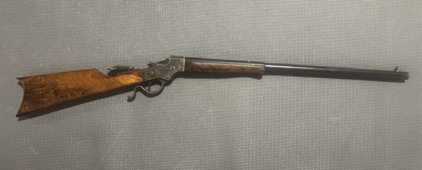 Stevens Model 44 rifle, full length, with tang peep sight, case-colored frame, and crescent buttplate