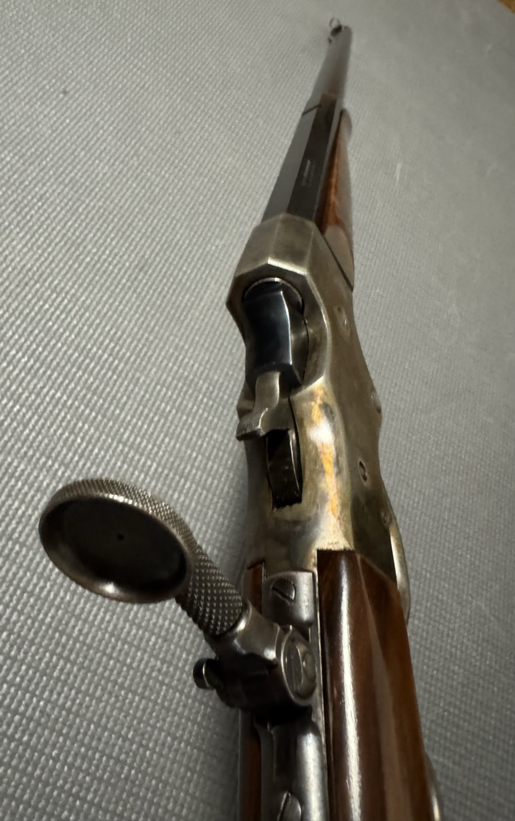 Stevens tang peep sight with large knurled aperture disc, seen from behind with the action open
